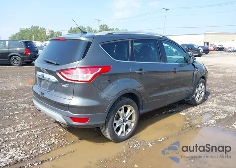 2016 Ford Escape Titanium z USA, uszkodzony, nr VIN 1FMCU9JX1GUC33014